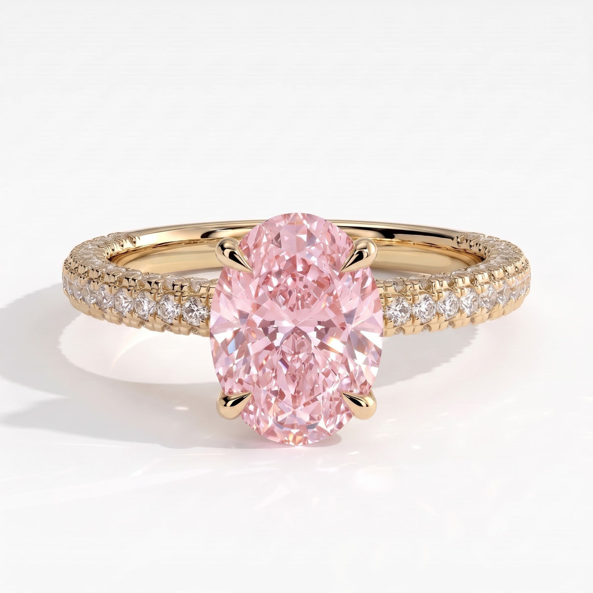 Fancy Vivid Pink oval lab-grown diamond engagement ring with triple pavé band and hidden halo in 18K (750) yellow gold, front view 