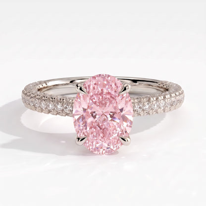 Fancy Vivid Pink oval lab-grown diamond engagement ring with triple pavé band and hidden halo in 950 platinum, front view 