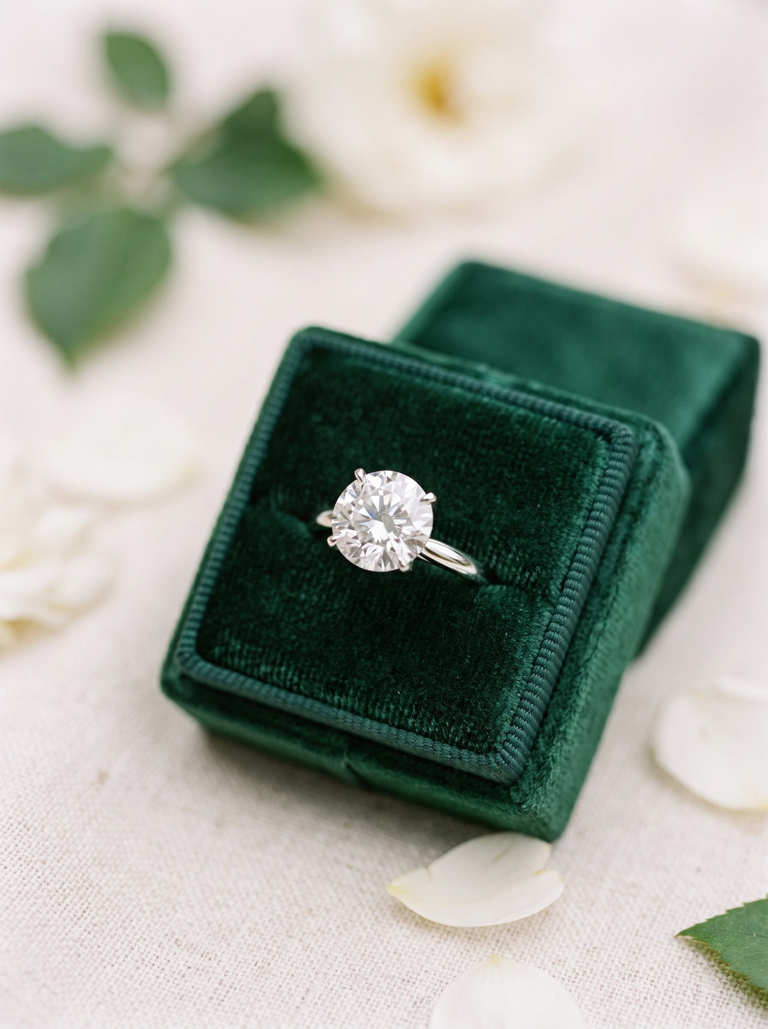 Round lab-grown diamond solitaire engagement ring in a green velvet box | BEUSÉA