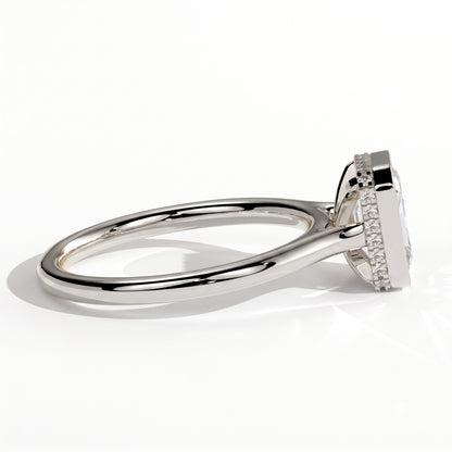 Emerald lab-grown diamond bezel-set halo engagement ring in 18K (750) white gold, detail view 