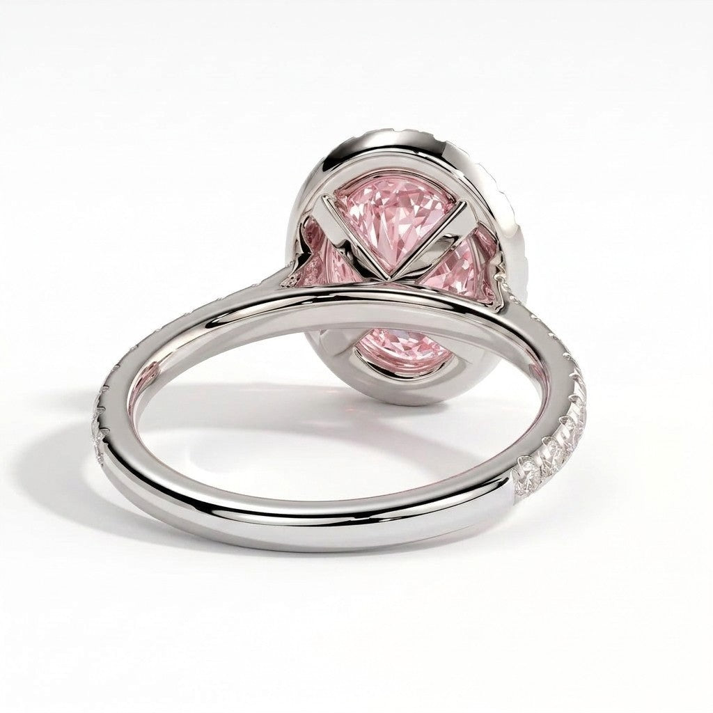 Fancy Vivid Pink oval lab-grown diamond halo engagement ring with cathedral pavé band in 14K (585) white gold, on white background 