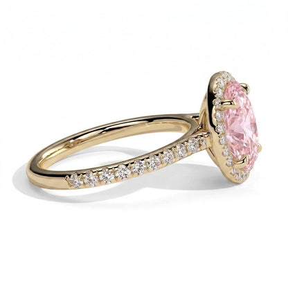 Fancy Vivid Pink oval lab-grown diamond halo engagement ring with cathedral pavé band in 18K (750) yellow gold, detail view of the halo and pavé band 