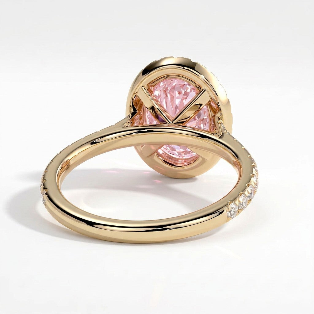 Fancy Vivid Pink oval lab-grown diamond halo engagement ring with cathedral pavé band in 18K (750) yellow gold, on white background 