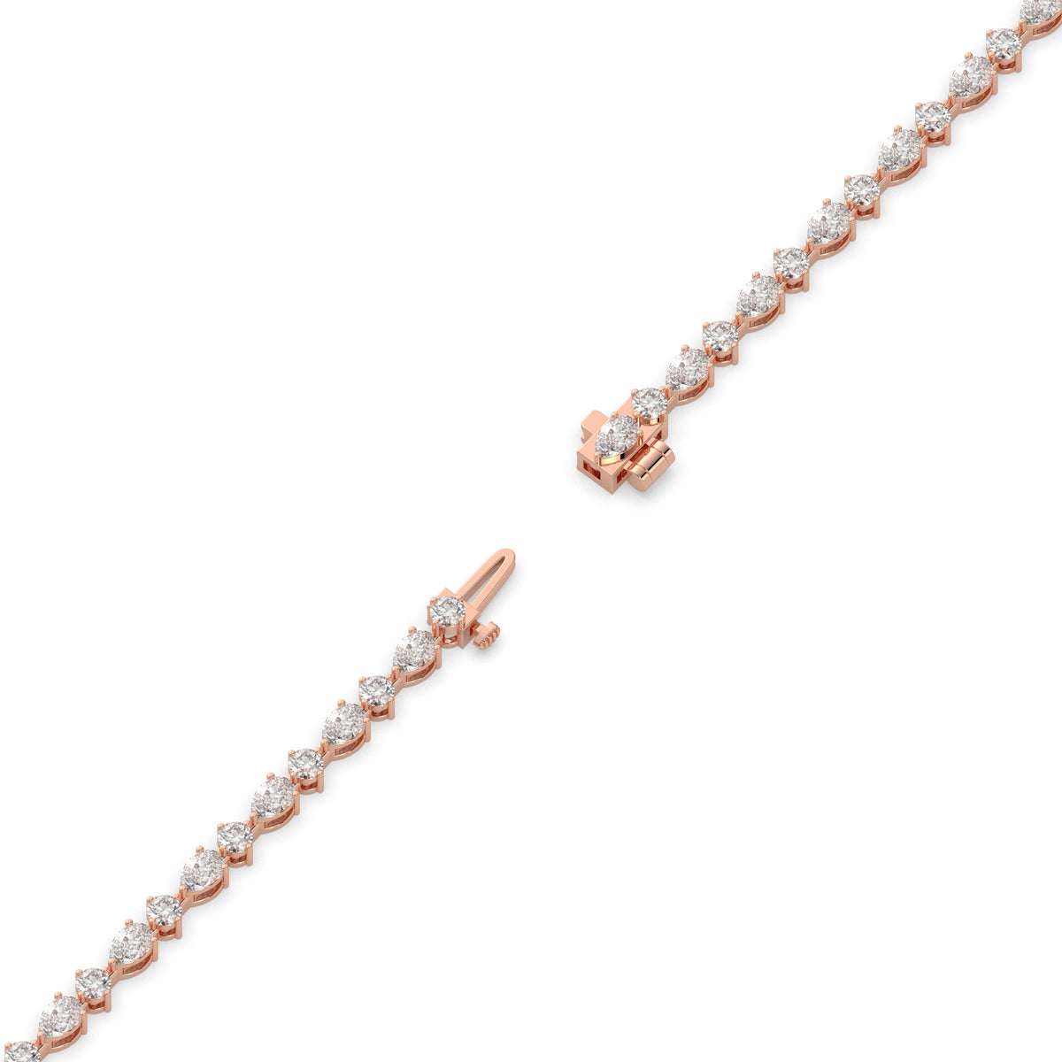 Delia pear and round lab-grown diamond tennis bracelet in 14K (585) rose gold, full length, diagonal view 