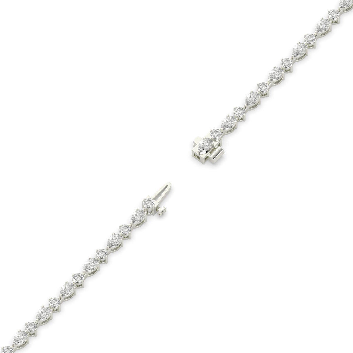 Delia pear and round lab-grown diamond tennis bracelet in 14K (585) white gold, full length, diagonal view 