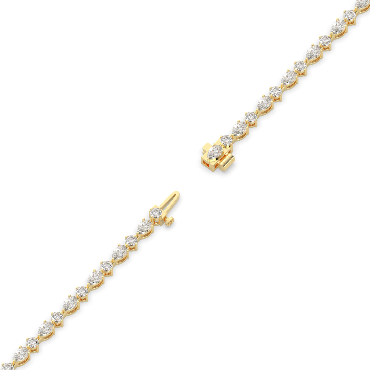 Delia pear and round lab-grown diamond tennis bracelet in 14K (585) yellow gold, full length, diagonal view 