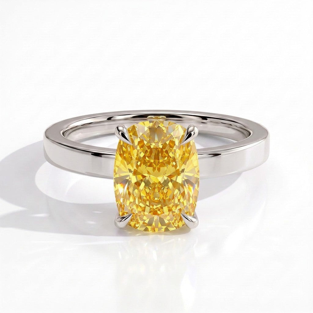 Fancy Vivid Yellow elongated cushion lab-grown diamond engagement ring with flat cigar band and hidden halo in 18K (750) white gold, front view 
