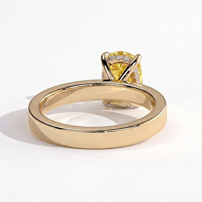 Fancy Vivid Yellow elongated cushion lab-grown diamond engagement ring with flat cigar band and hidden halo in 18K (750) yellow gold, on white background 