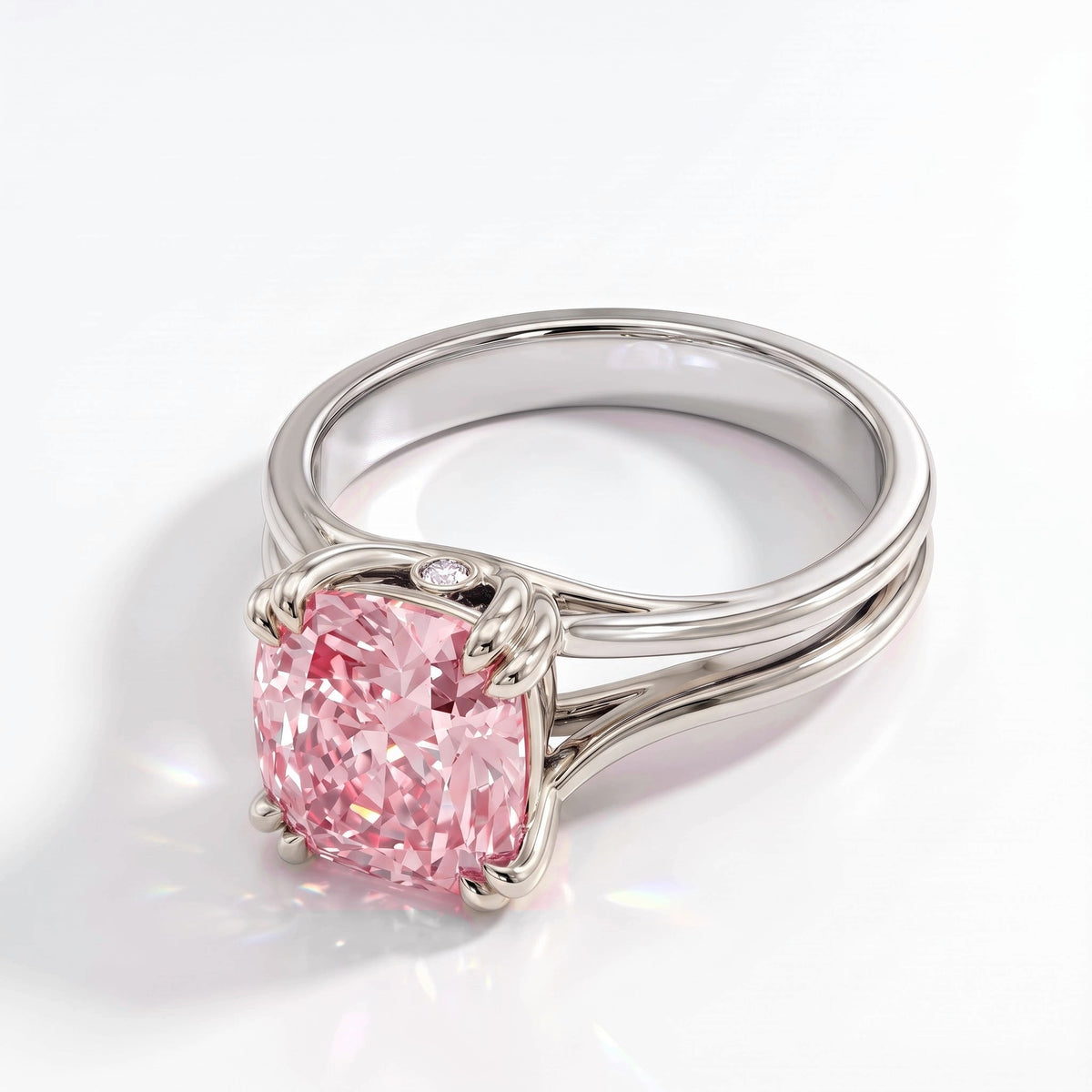 Fancy Vivid Pink cushion lab-grown diamond split shank ring in 18K (750) white gold, angled view 