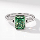 Fancy Vivid Green radiant lab-grown diamond bezel ring in 950 platinum, angled top view 