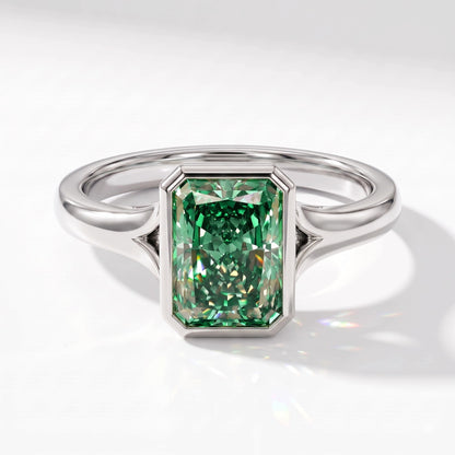 Fancy Vivid Green radiant lab-grown diamond bezel ring in 950 platinum, angled top view 