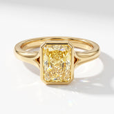 Fancy Vivid Yellow radiant lab-grown diamond bezel ring in 18K (750) yellow gold, angled top view 