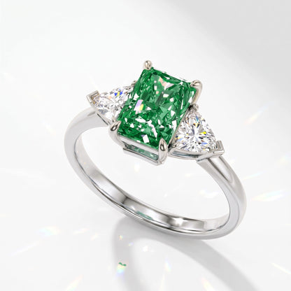 Fancy Vivid Green radiant lab-grown diamond three-stone ring with trillion side diamonds in 14K (585) white gold, angled view 