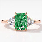 Fancy Vivid Green radiant lab-grown diamond three-stone ring with trillion side diamonds in 14K (585) rose gold, top view 