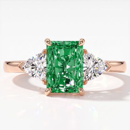 Fancy Vivid Green radiant lab-grown diamond three-stone ring with trillion side diamonds in 14K (585) rose gold, top view 