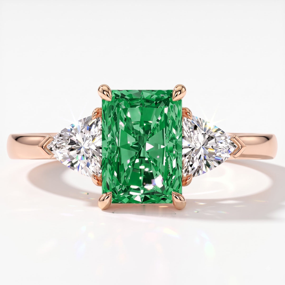 Fancy Vivid Green radiant lab-grown diamond three-stone ring with trillion side diamonds in 18K (750) rose gold, top view 