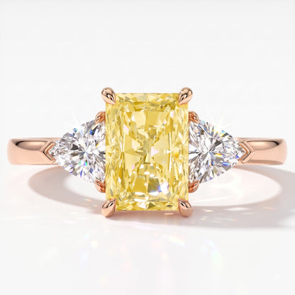 Fancy Vivid Yellow radiant lab-grown diamond three-stone ring with trillion side diamonds in 14K (585) rose gold, top view 