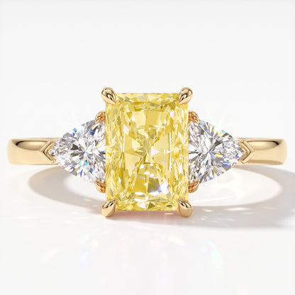 Fancy Vivid Yellow radiant lab-grown diamond three-stone ring with trillion side diamonds in 18K (750) yellow gold, top view 