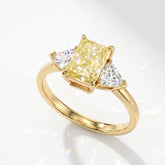 Fancy Vivid Yellow radiant lab-grown diamond three-stone ring with trillion side diamonds in 18K (750) yellow gold, angled view 
