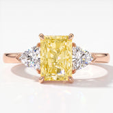 Fancy Vivid Yellow radiant lab-grown diamond three-stone ring with trillion side diamonds in 18K (750) rose gold, top view 