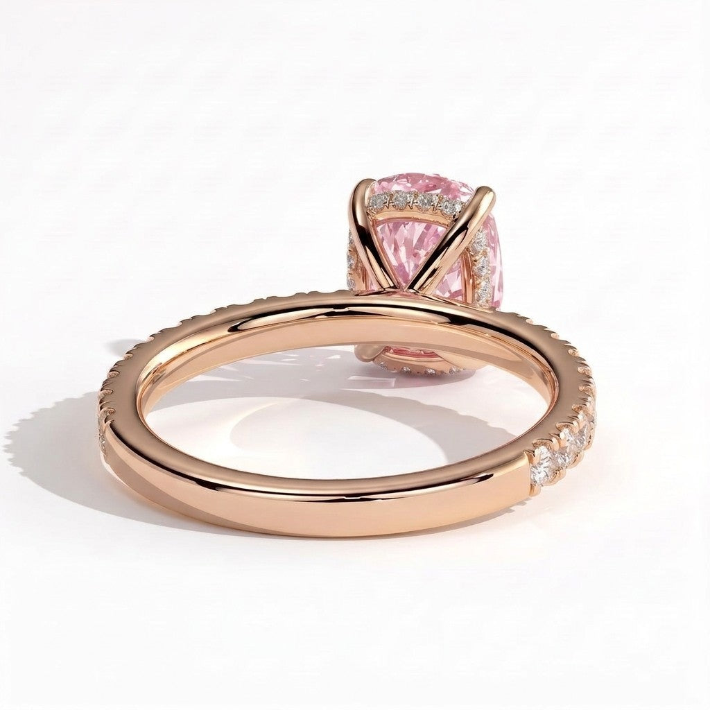 Fancy Vivid Pink elongated cushion lab-grown diamond engagement ring with hidden halo and pavé band in 14K (585) rose gold, on white background 