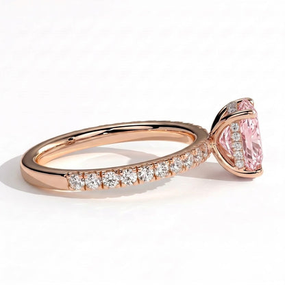 Fancy Vivid Pink elongated cushion lab-grown diamond engagement ring with hidden halo and pavé band in 18K (750) rose gold, detail view of the pavé band 