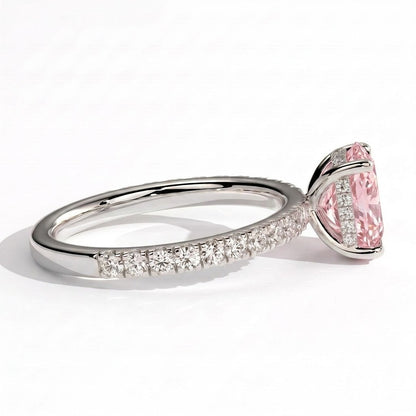Fancy Vivid Pink elongated cushion lab-grown diamond engagement ring with hidden halo and pavé band in 18K (750) white gold, detail view of the pavé band 