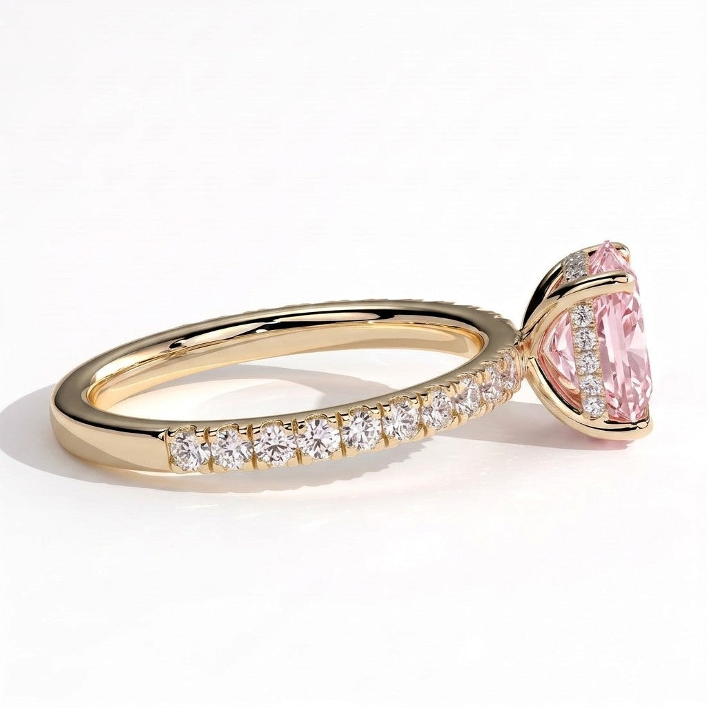 Fancy Vivid Pink elongated cushion lab-grown diamond engagement ring with hidden halo and pavé band in 18K (750) yellow gold, detail view of the pavé band 