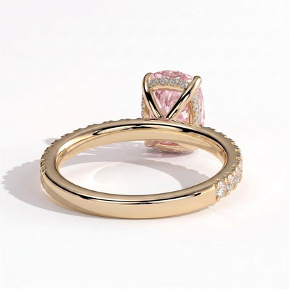 Fancy Vivid Pink elongated cushion lab-grown diamond engagement ring with hidden halo and pavé band in 18K (750) yellow gold, on white background 