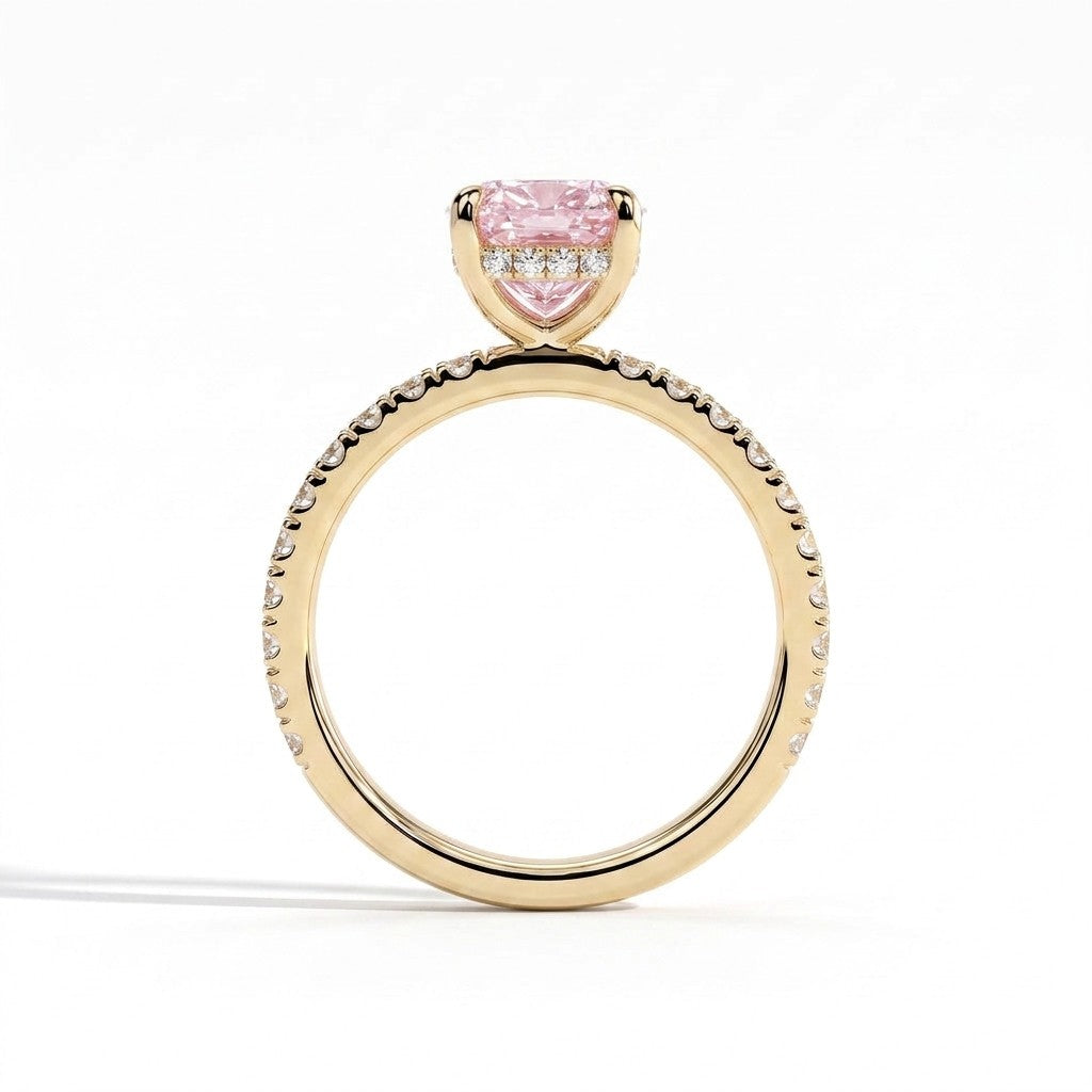 Fancy Vivid Pink elongated cushion lab-grown diamond engagement ring with hidden halo and pavé band in 18K (750) yellow gold, side profile showing the hidden halo 