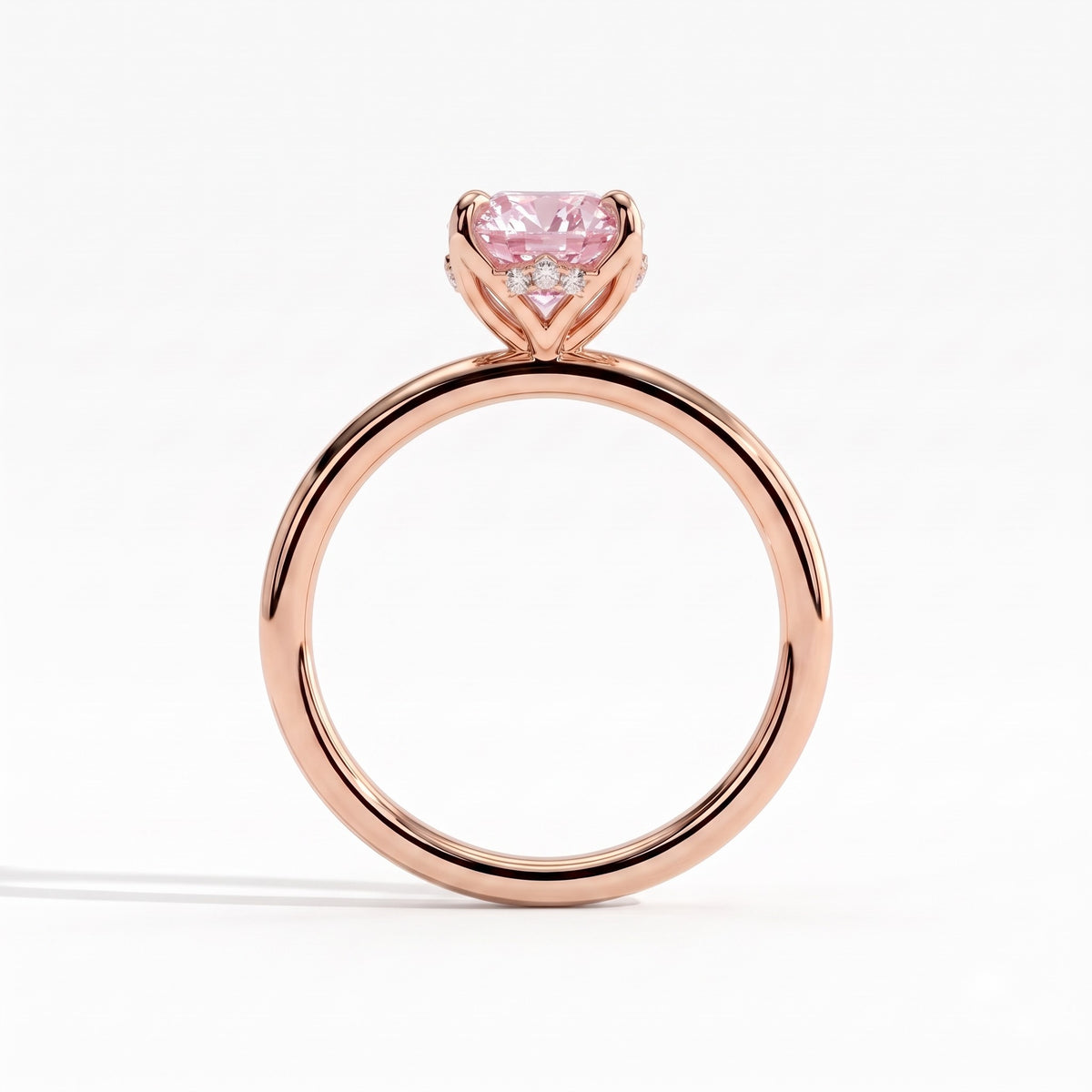 Fancy Vivid Pink oval lab-grown diamond solitaire engagement ring with petal gallery and hidden tiara in 14K (585) rose gold, side profile showing the petal gallery 