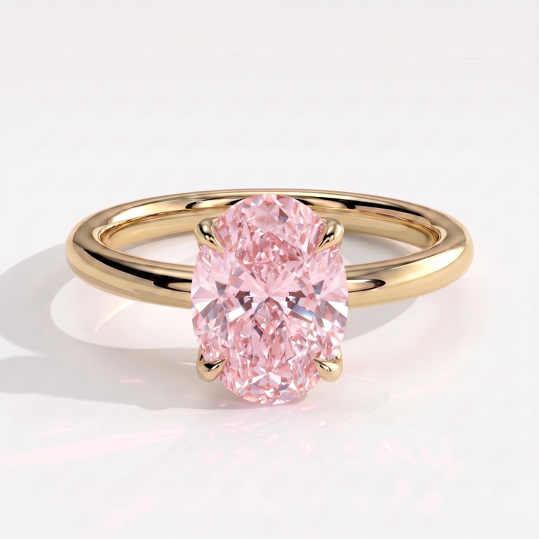 Fancy Vivid Pink oval lab-grown diamond solitaire engagement ring with petal gallery and hidden tiara in 14K (585) yellow gold, front view 