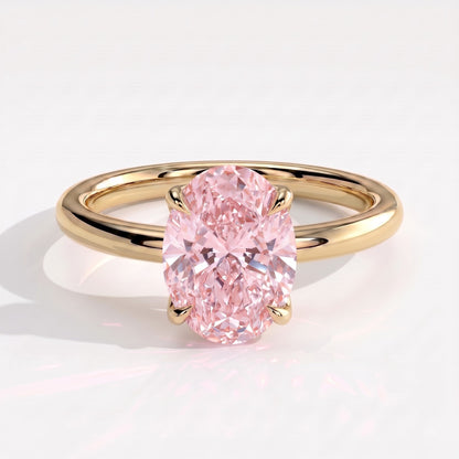 Fancy Vivid Pink oval lab-grown diamond solitaire engagement ring with petal gallery and hidden tiara in 18K (750) yellow gold, front view 