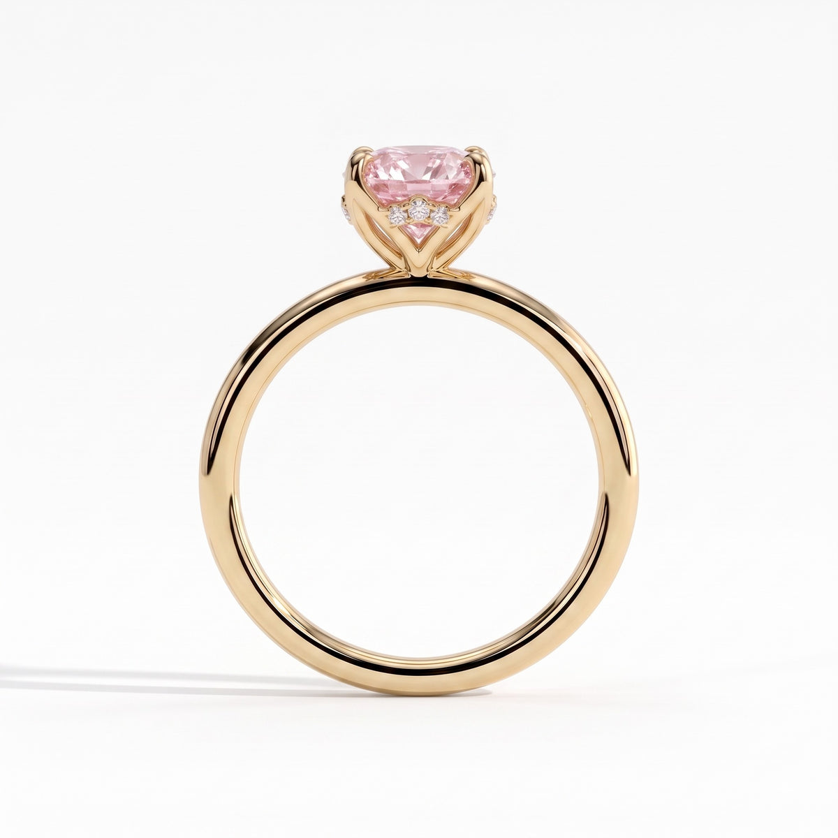 Fancy Vivid Pink oval lab-grown diamond solitaire engagement ring with petal gallery and hidden tiara in 18K (750) yellow gold, side profile showing the petal gallery 