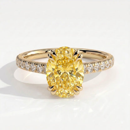 Fancy Vivid Yellow oval lab-grown diamond double claw engagement ring with pavé band and hidden halo in 14K (585) yellow gold, front view 