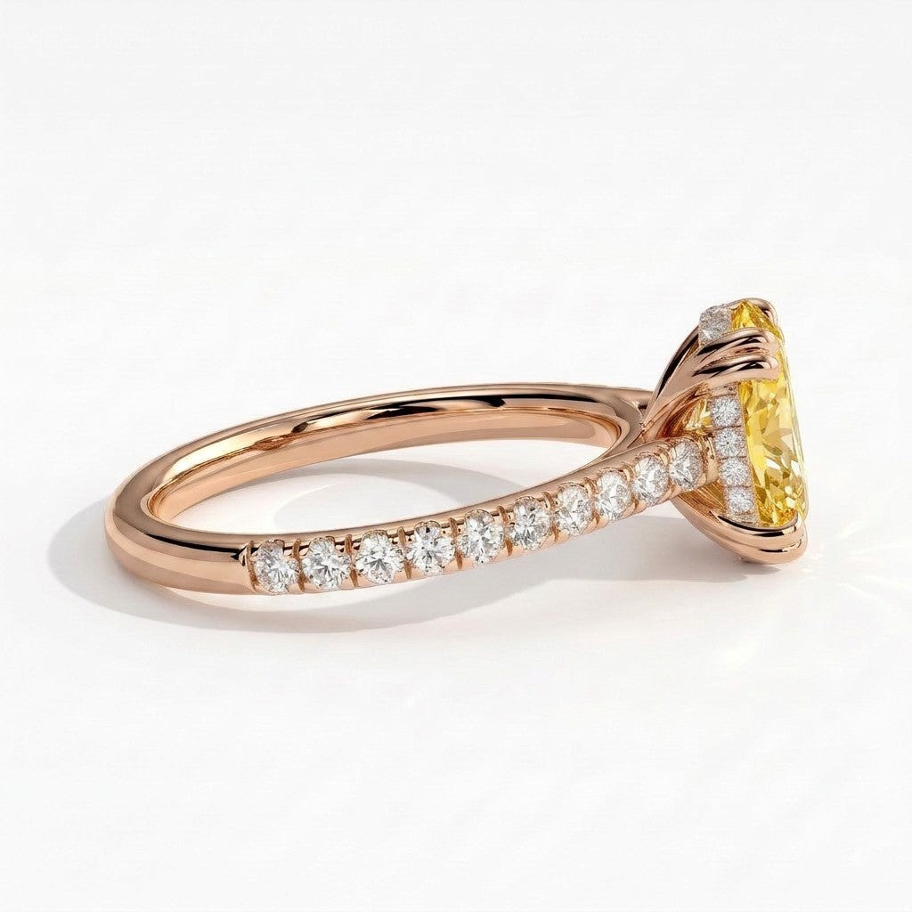 Fancy Vivid Yellow oval lab-grown diamond double claw engagement ring with pavé band and hidden halo in 18K (750) rose gold, detail view of the pavé band 