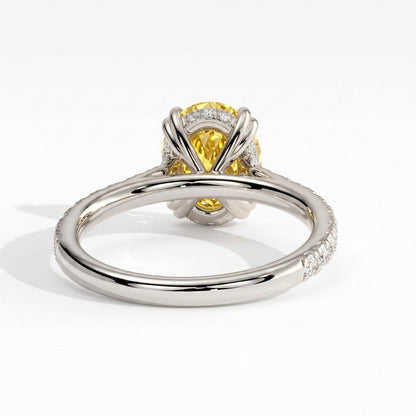 Fancy Vivid Yellow oval lab-grown diamond double claw engagement ring with pavé band and hidden halo in 18K (750) white gold, back view showing the hidden halo 