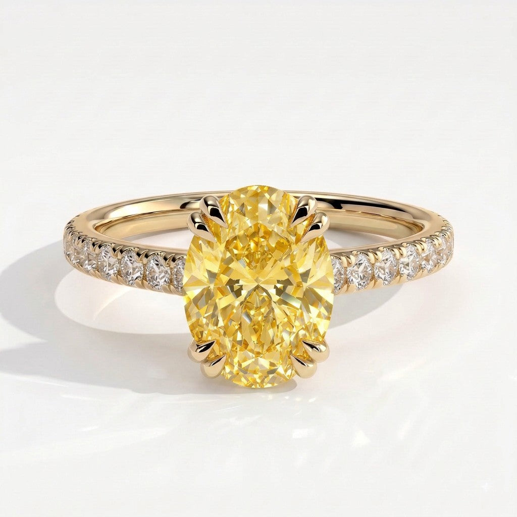 Fancy Vivid Yellow oval lab-grown diamond double claw engagement ring with pavé band and hidden halo in 18K (750) yellow gold, front view 