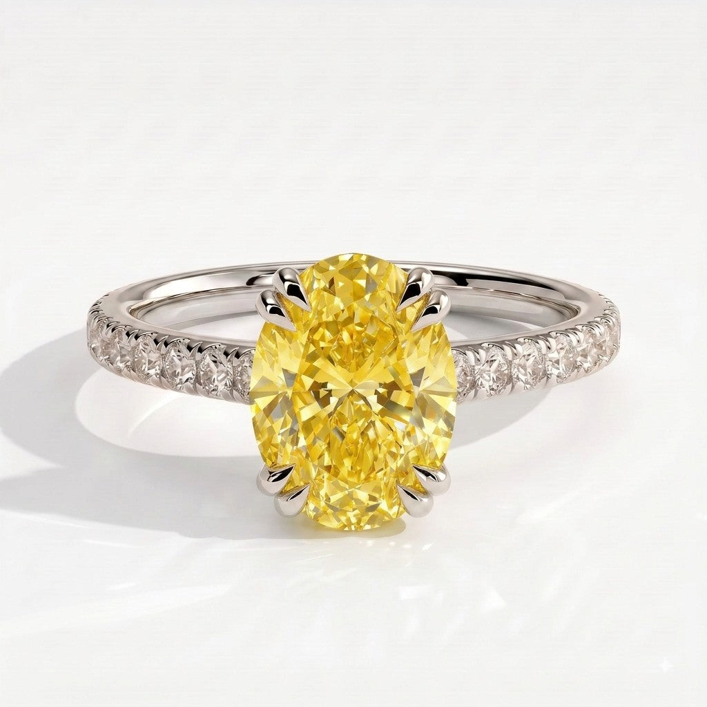 Fancy Vivid Yellow oval lab-grown diamond double claw engagement ring with pavé band and hidden halo in 950 platinum, front view 