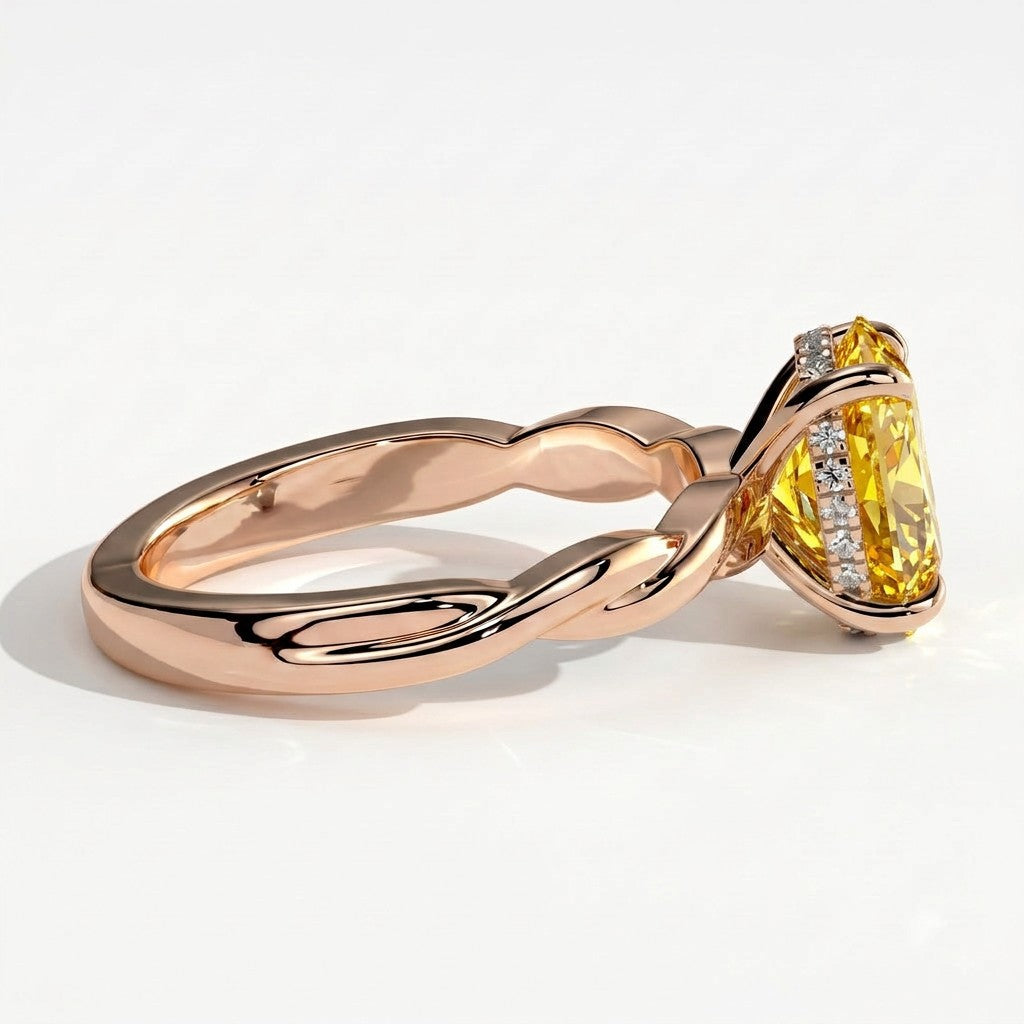 Fancy Vivid Yellow oval lab-grown diamond solitaire engagement ring with twisted band in 14K (585) rose gold, detail view of the twisted band 