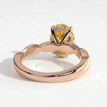 Fancy Vivid Yellow oval lab-grown diamond solitaire engagement ring with twisted band in 14K (585) rose gold, on white background 