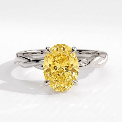 Fancy Vivid Yellow oval lab-grown diamond solitaire engagement ring with twisted band in 14K (585) white gold, front view 