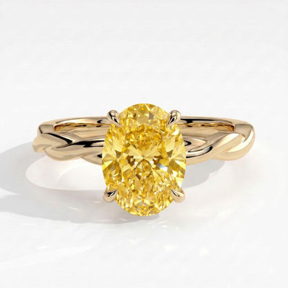 Fancy Vivid Yellow oval lab-grown diamond solitaire engagement ring with twisted band in 14K (585) yellow gold, front view 