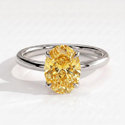 Fancy Vivid Yellow oval lab-grown diamond solitaire engagement ring with petal gallery and hidden tiara in 14K (585) white gold, front view 