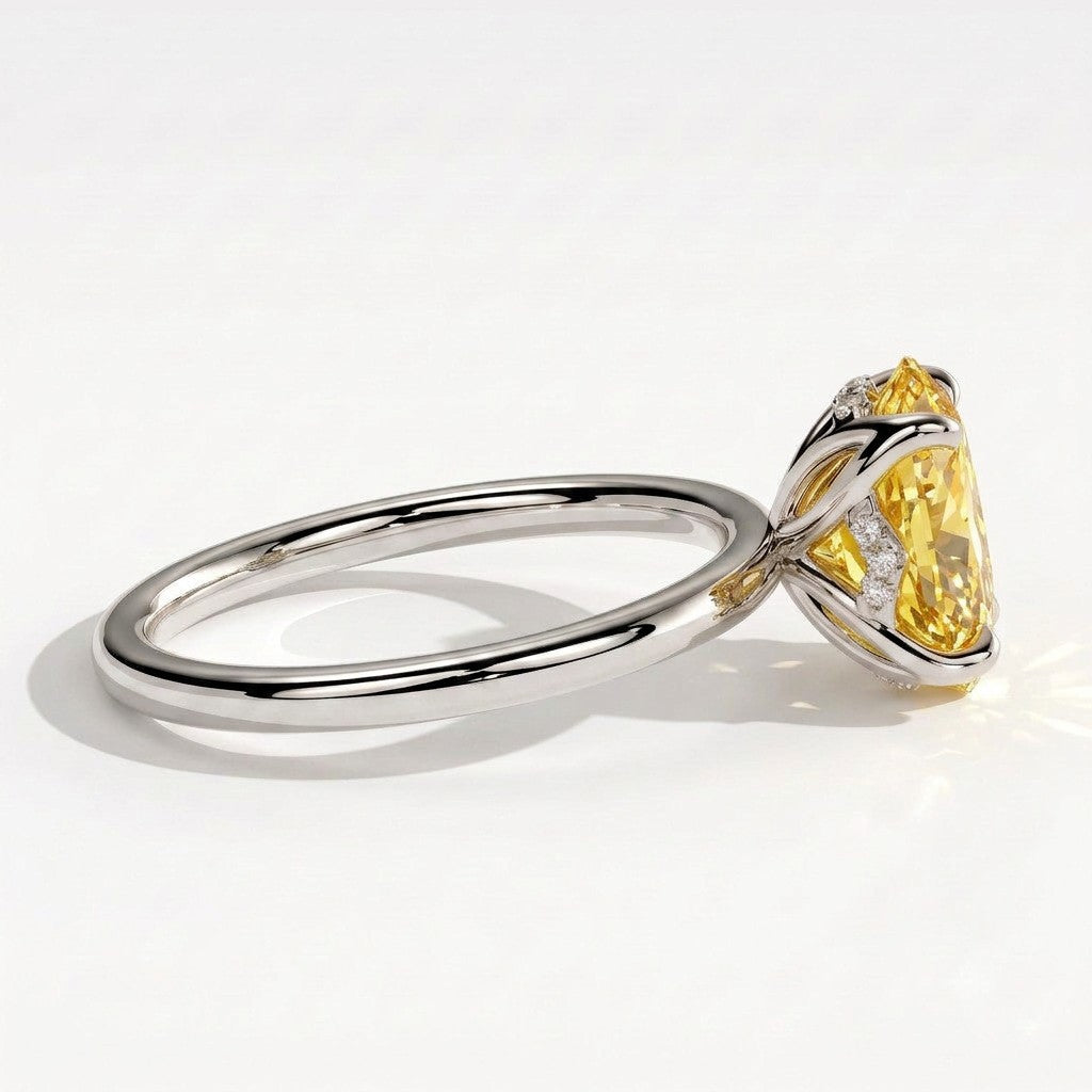 Fancy Vivid Yellow oval lab-grown diamond solitaire engagement ring with petal gallery and hidden tiara in 950 platinum, detail view of the hidden tiara 