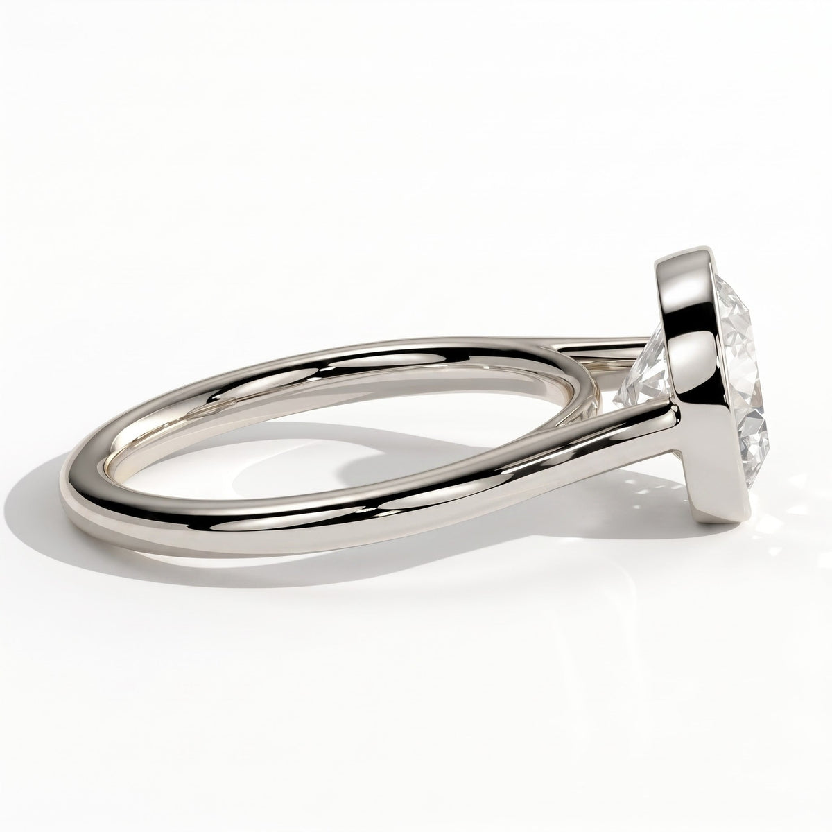 Round lab-grown diamond bezel-set solitaire engagement ring in 950 platinum, detail view 