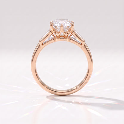 Old mine round lab-grown diamond vintage three-stone engagement ring with tapered baguettes in 14K (585) rose gold, profile view showing the six-claw crown basket 