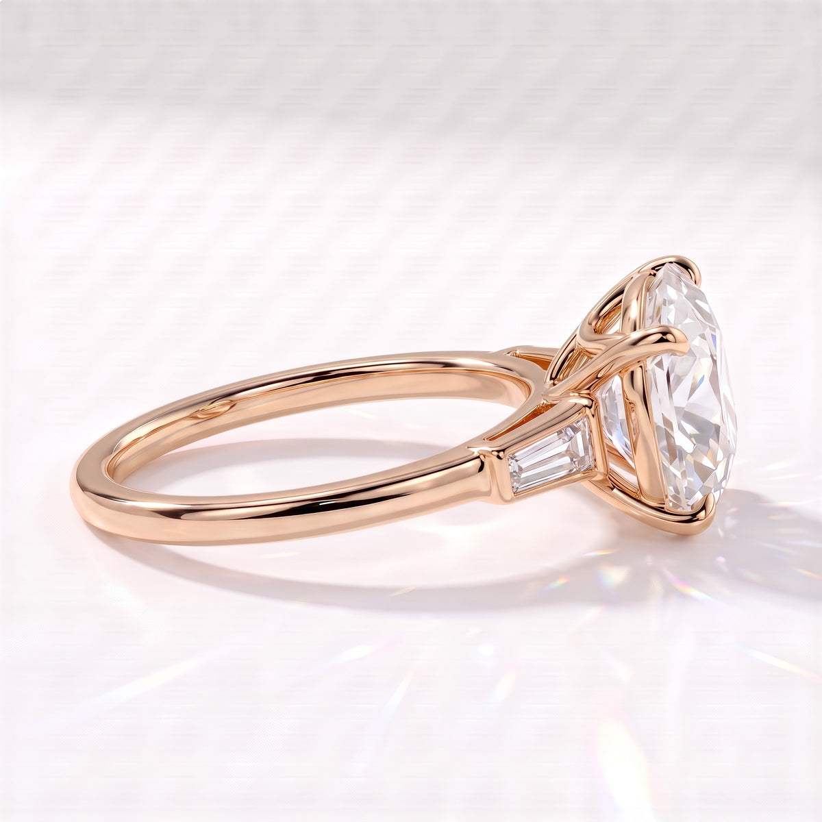 Old mine round lab-grown diamond vintage three-stone engagement ring with tapered baguettes in 14K (585) rose gold, side view showing the tapered baguette 