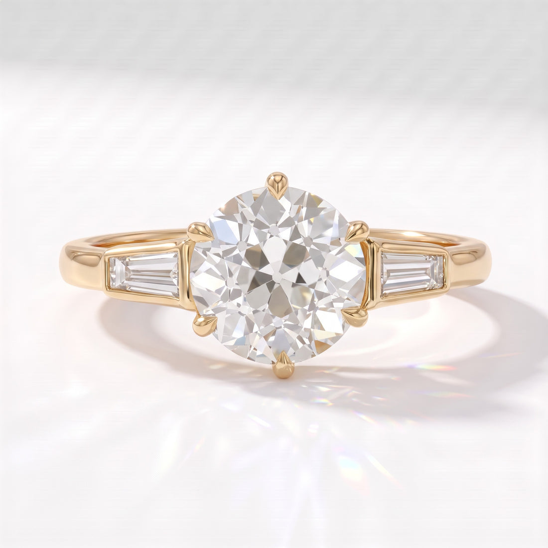 Old mine round lab-grown diamond vintage three-stone engagement ring with tapered baguettes in 14K (585) yellow gold, front view 