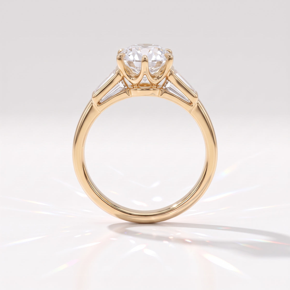 Old mine round lab-grown diamond vintage three-stone engagement ring with tapered baguettes in 14K (585) yellow gold, profile view showing the six-claw crown basket 